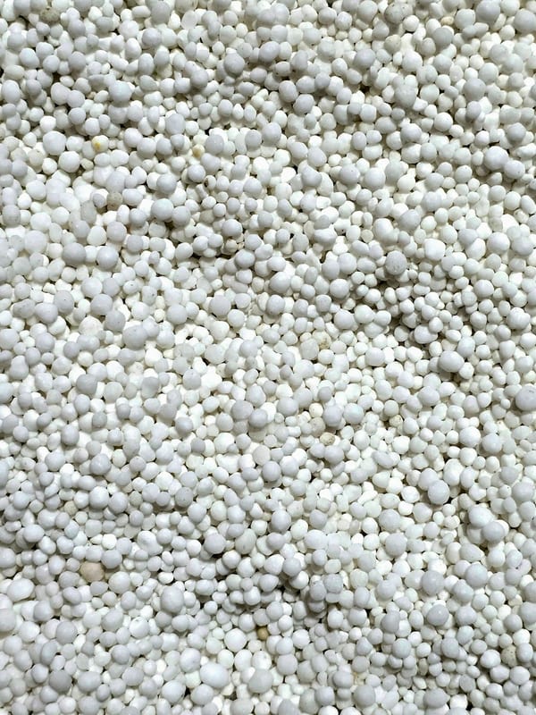 Close-up texture of white prilled nitrogen fertilizer