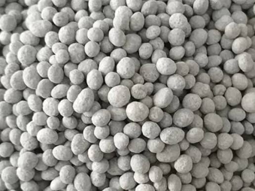 Close-up of mottled grey-white compound NPK granules