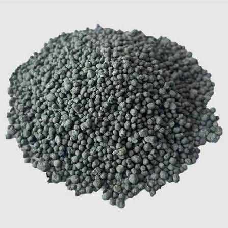 A pile of dark grey granular single super phosphate