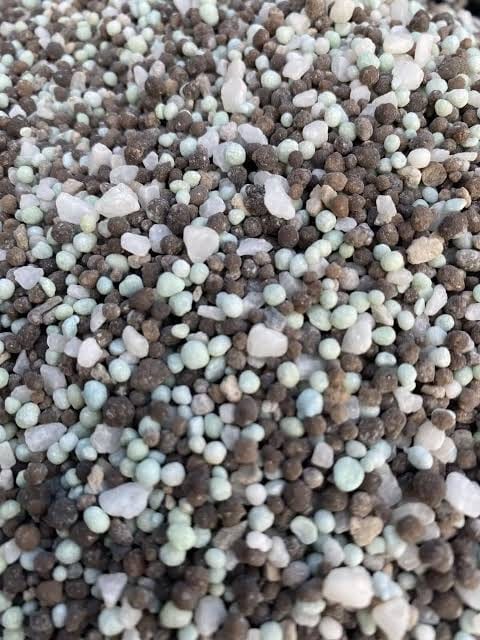 Mixed pale green and brown starter NPK granules